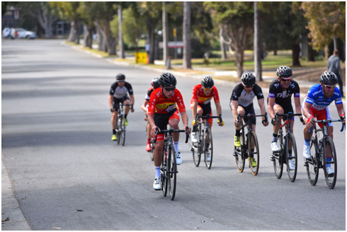 David in the black and purple kit rolling turns with some semi professional riders at the Glenvale A Grade Criterium.